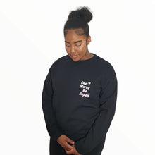 Load image into Gallery viewer, Girl pictured wearing black 'Don't Worry Be Happy' sweatshirt from Pink Runway's Bright Future range.