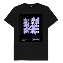 Load image into Gallery viewer, Black T shirt with Graffiti style stars in purple and white text saying Shine Bright beneath. Pink Runway design girls t shirt.